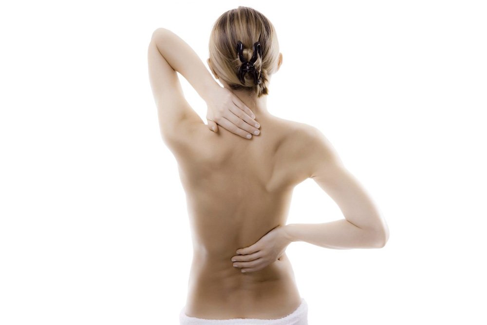 Боль в области спины и симптомы остеохондроза