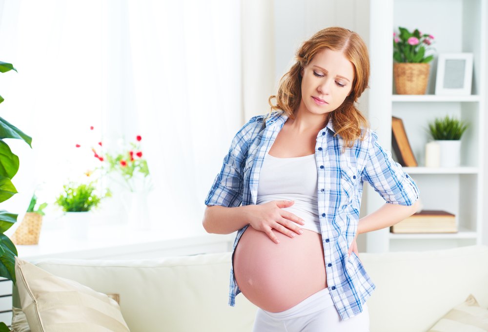Патологические боли в животе в период беременности: причины и симптомыg