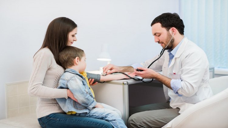 measuring blood pressure of a child